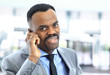 Attractive smiling Afro-American young businessman