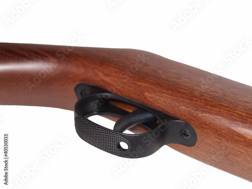 Photo: Rifle trigger isolated on white background Rifle trigger isolated on white background