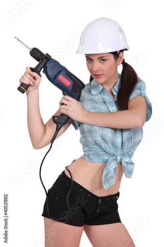 Photo: sexy woman using a power drill sexy woman using a power drill