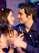 Foto: Couple with glasses of champagne on date Couple with glasses of champagne on date