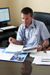 Doctor Writing On A Document