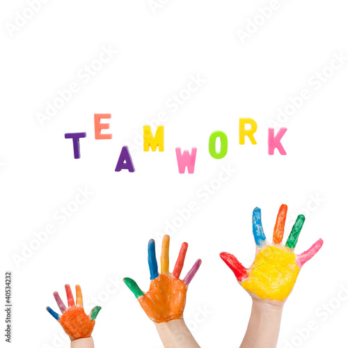 Photo: Three colorful hands drawn to the word "teamwork" Three colorful hands drawn to the word "teamwork"