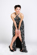 The beautiful brunette in a long dress