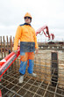builder worker at concrete pouring work