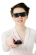 Woman in 3d glasses holding a television pilot