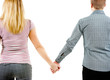 A young couple holding each other's hands