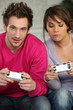 Young couple playing video games