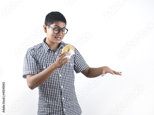 Photo: Indian Man Happy with his pastry Indian Man Happy with his pastry