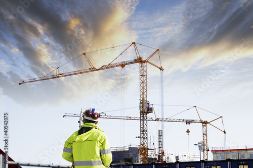 Photo: geodetist and construction site, industry geodetist and construction site, industry