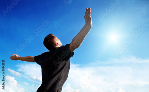 Photo: youmg man and sunny sky youmg man and sunny sky