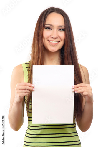 Photo: A cute young girl with a blank, isolated on white A cute young girl with a blank, isolated on white