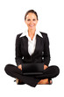 young businesswoman sitting on floor and using laptop