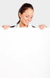 smiling businesswoman looking down white board
