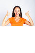 cheerful woman thumbs up with white board