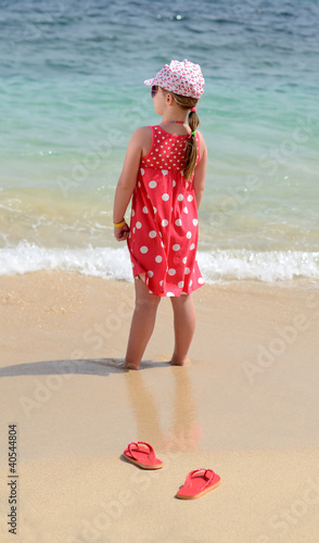Photo: Child girl on tropical beach Child girl on tropical beach