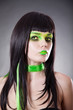 Portrait of attractive woman with green make-up