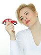 Pretty woman dreaming of a new red car