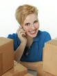 Woman with many packets grooving as a parcel service