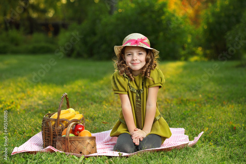 Photo: girl with fruit in park girl with fruit in park