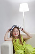 Photo: beauty girl read book on sofa beauty girl read book on sofa
