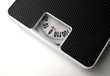 Photo: Dieting concept with scales on the white background Dieting concept with scales on the white background