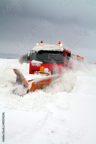 Photo: snowplow in winter snow storm snowplow in winter snow storm