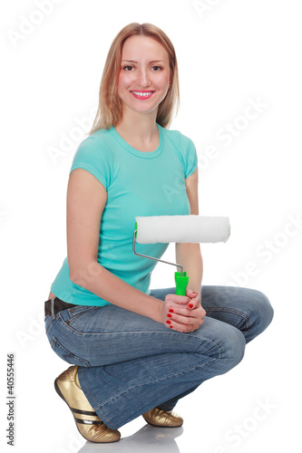 Photo: Smiling woman with a brush against the white background Smiling woman with a brush against the white background