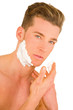 Young man shaving