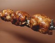Grilled chickens on a spit