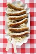 Sausages with sauerkraut on paper plate