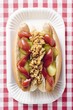 Two hot dogs on paper plate