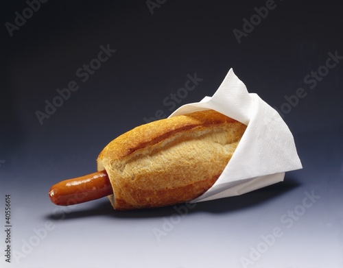 Photo: Hot dog with white napkin Hot dog with white napkin