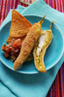 Breaded chillies stuffed with sheep's cheese, salsa & chips
