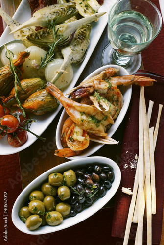 Photo: Antipasti platter, scampi and olives; grissini Antipasti platter, scampi and olives; grissini