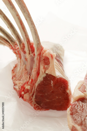 Photo: Fresh lamb cutlets on paper Fresh lamb cutlets on paper