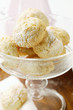 Amaretti with icing sugar in dessert bowl