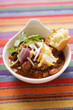 Chili con carne with cheese, sour cream and corn bread