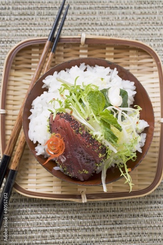 Photo: Raw tuna fillet with poppy seeds, rice and salad Raw tuna fillet with poppy seeds, rice and salad