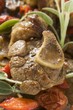 Osso buco with tomatoes and sage (close-up)