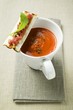 Creamed pepper soup in soup cup and crostini