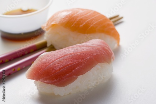 Photo: Nigiri sushi with tuna & salmon, chopsticks & soy sauce Nigiri sushi with tuna & salmon, chopsticks & soy sauce