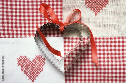 Photo: Heart-shaped biscuits with red gift ribbon Heart-shaped biscuits with red gift ribbon