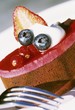 Small cake topped with berry mousse
