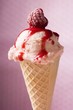 Ice cream with raspberry and raspberry sauce in wafer cone