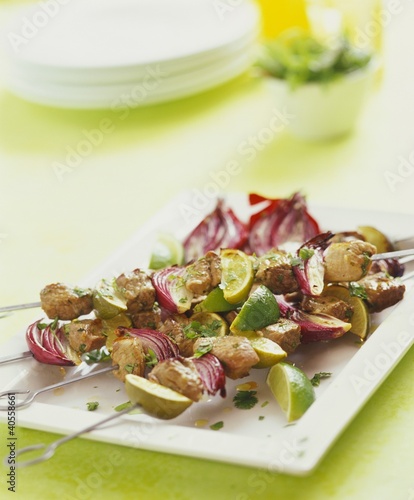 Photo: Lamb and onion kebabs with lime wedges Lamb and onion kebabs with lime wedges