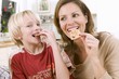Photo: Mother and son eating Christmas biscuits Mother and son eating Christmas biscuits