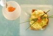 Scrambled egg, salmon caviar and chives on toast
