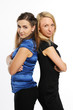 Two young attractive women standing