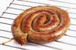 Coiled sausage on oven rack