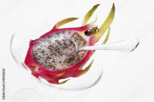 Photo: Half a pitahaya in glass bowl with teaspoon Half a pitahaya in glass bowl with teaspoon